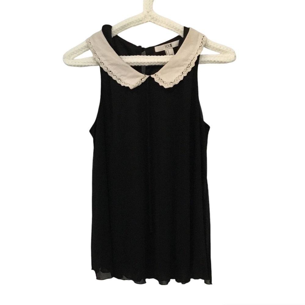 Black sleeveless top with white Peter Pan collar, two layers